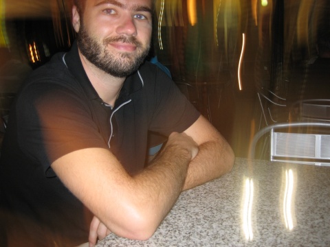 Enjoying an evening at an outdoor caf&eacute; - with accidental light effects.